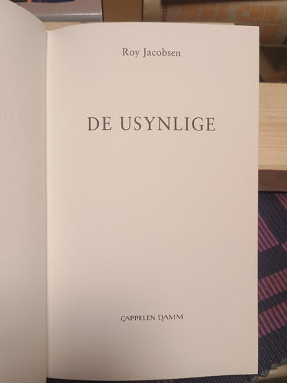 De usynlige, Roy Jacobsen